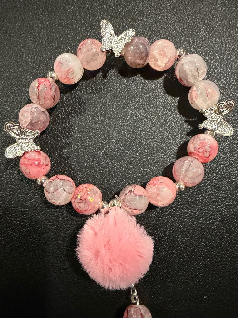 Pink Beaded Bracelet with Butterfly Charms and Pom Pom